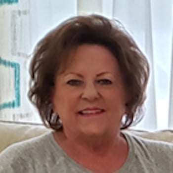 Headshot of a smiling woman.