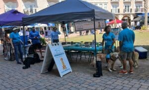 Hearts of Gold Therapy Team's table set up at the Flagler Humane Society's Bark in the Bark event.